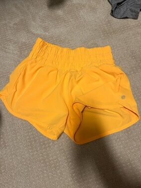 Athleta bright orange short shorts